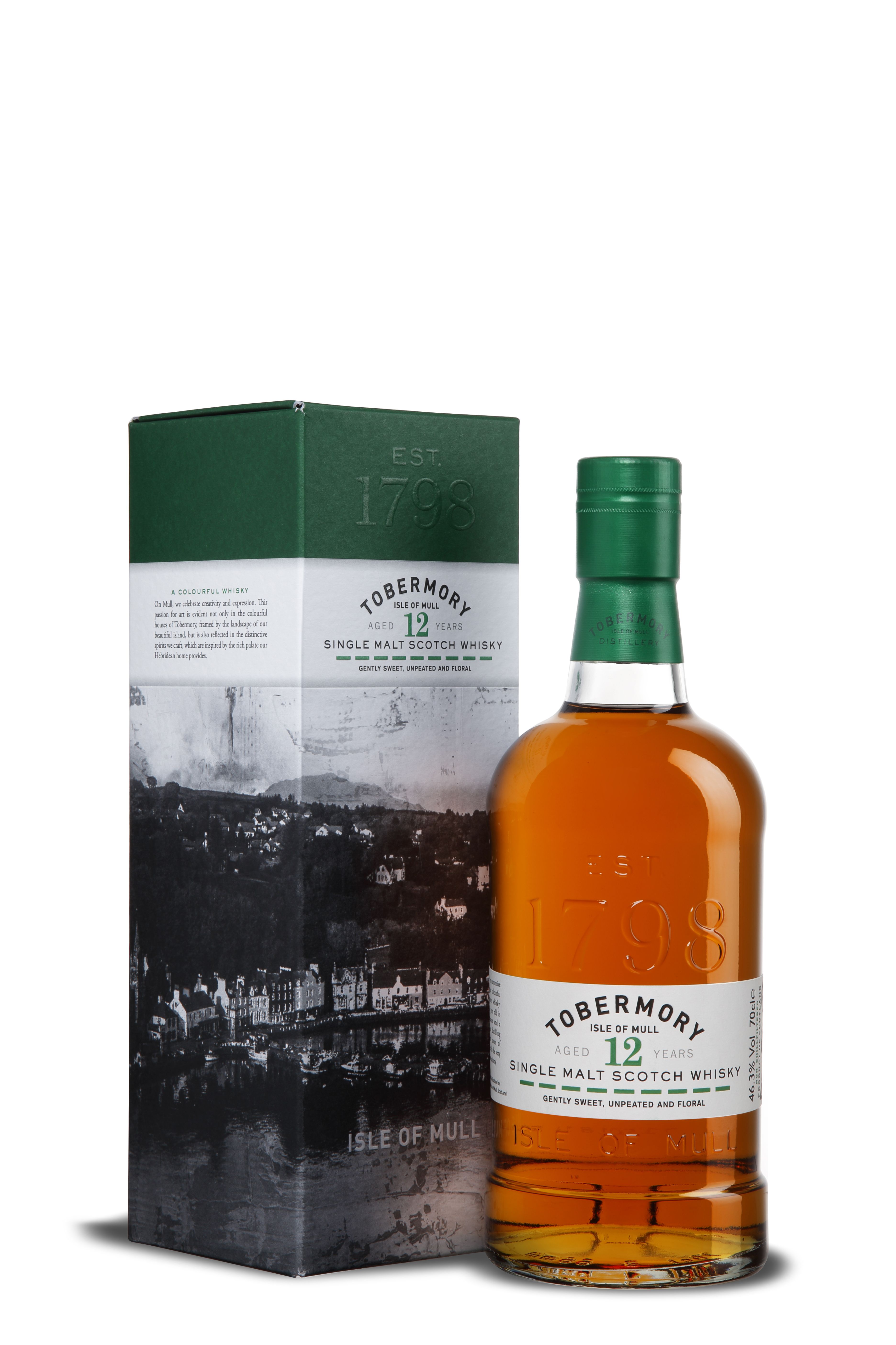Die Flasche Tobermory 12 Years Single Malt Scotch Whisky steht neben der passenden Box. Beide zeigen eine grün-weiße Farbgebung mit schwarzer Fotografie der Isle of Mull. Aufdrucke nennen Alter, Herkunft und „Gently Sweet, Unpeated and Floral“.