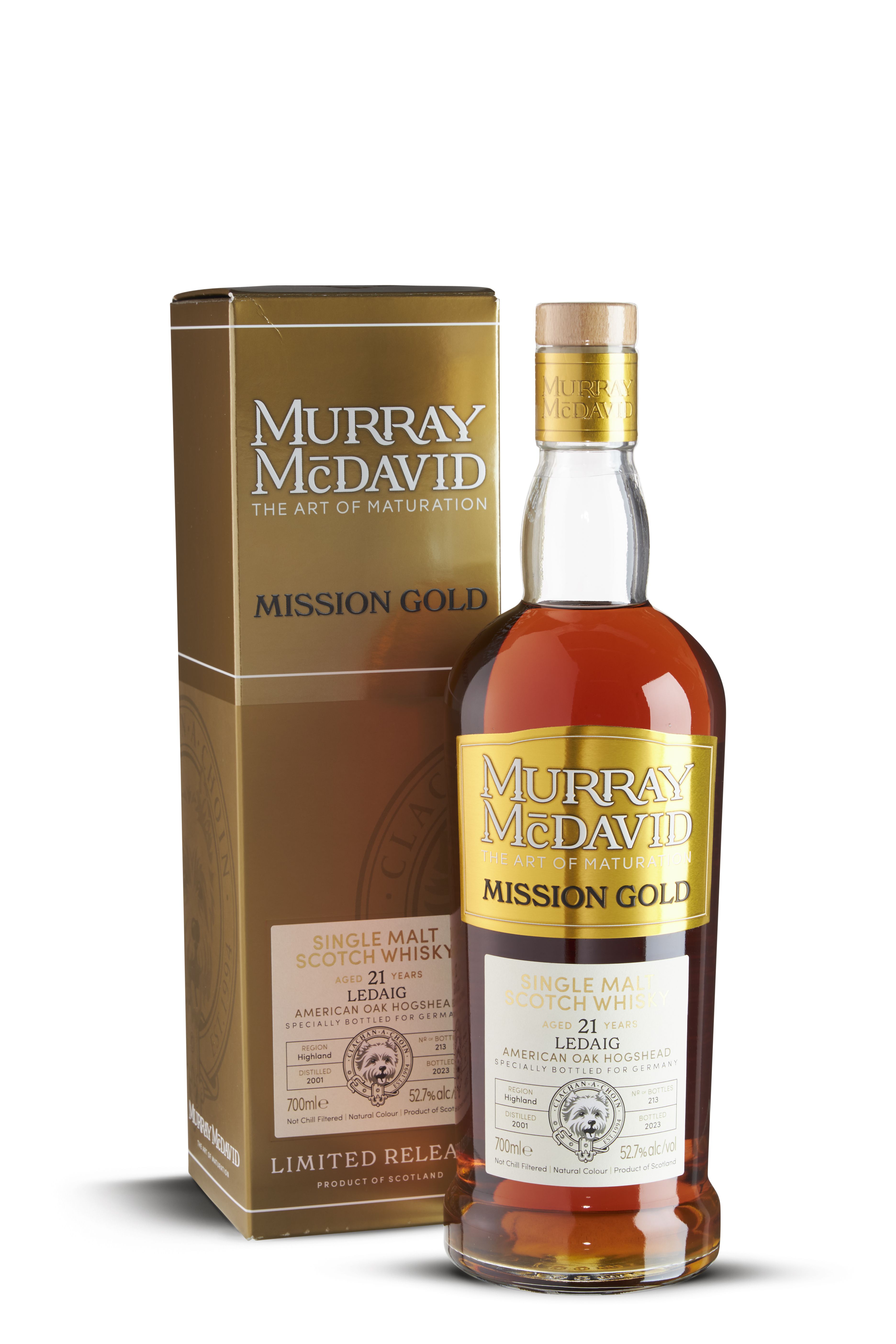 Flasche und Verpackung „Murray McDavid Mission Gold“ Single Malt Scotch Whisky. 21 Jahre alt, Ledaig, American Oak Hogshead, 52,7% vol., bernsteinfarbener Whisky, goldenes Etikett, abgerundeter Flaschenhals mit goldenem Siegel.